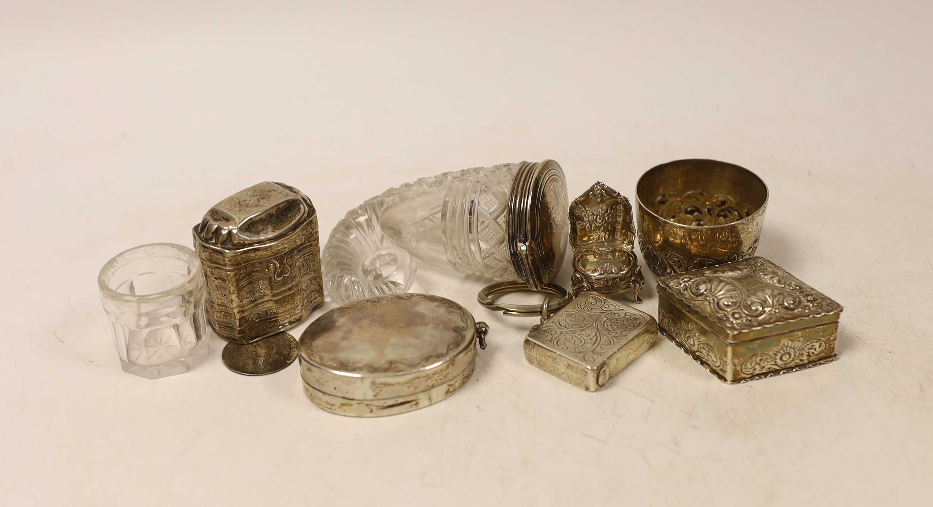 An early 19th century silver mounted cut glass snuff mull, 87mm, two white metal boxes including Dutch, a Victorian small silver cup, silver pill box, silver vesta case and a silver counter by Simon van de Passe, depicti